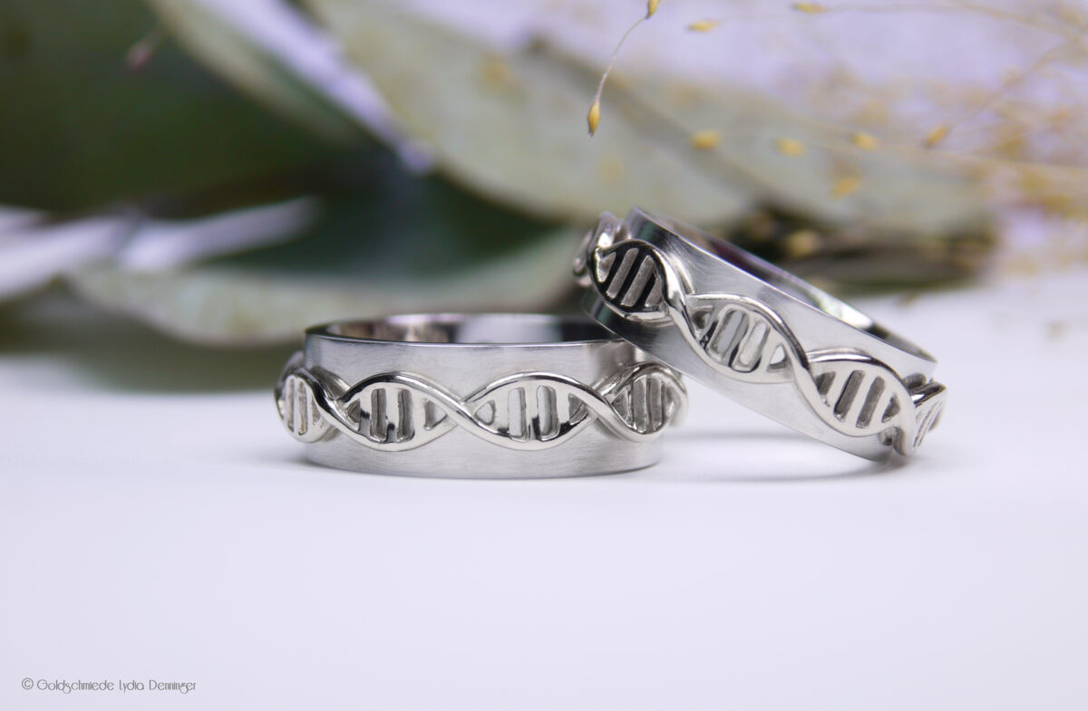 Exklusive DNA-Eheringe: Kombination aus edlem Platin und 585er Weißgold – Symbol für ewige Verbundenheit auf tiefster Ebene.